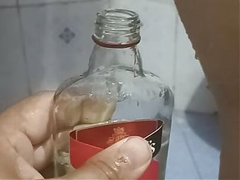 Bhabi pissing in rum bottle 